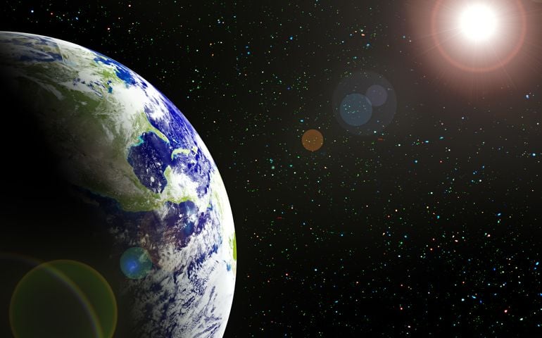 The planet Earth in sun beams