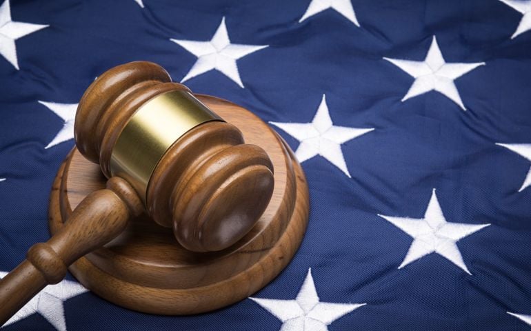 gavel of supreme court on the american flag