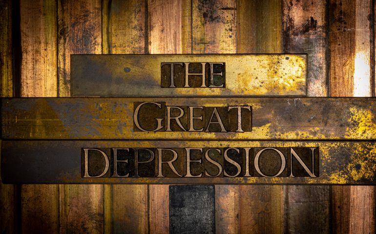 Photo of real authentic typeset letters forming The Great Depression text on vintage textured grunge copper and black background