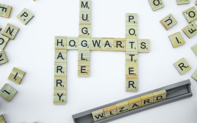 Scrabble letters spelling Harry, Potter, Muggle, Hogwarts, Wizard