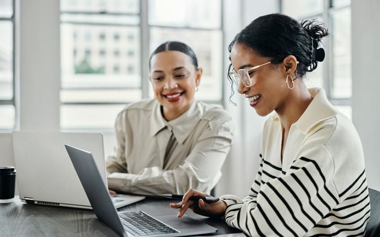two women working together at the office