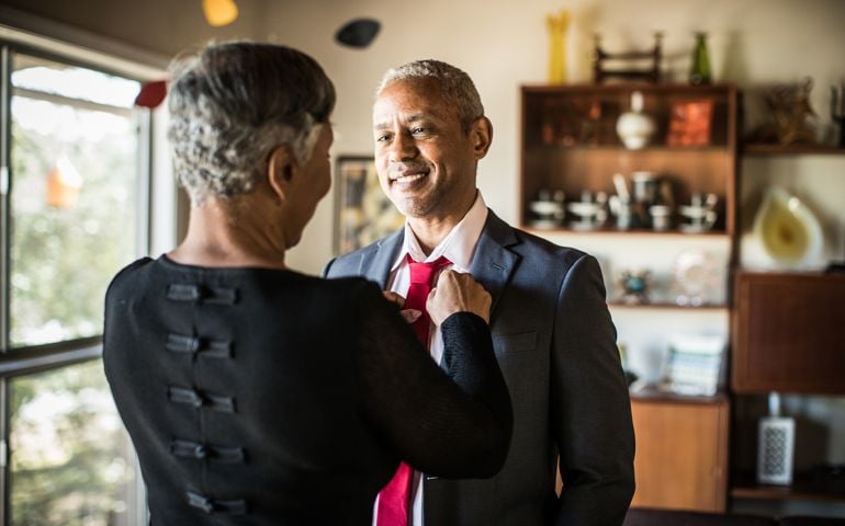 Senior couple (60yrs) getting ready to go out