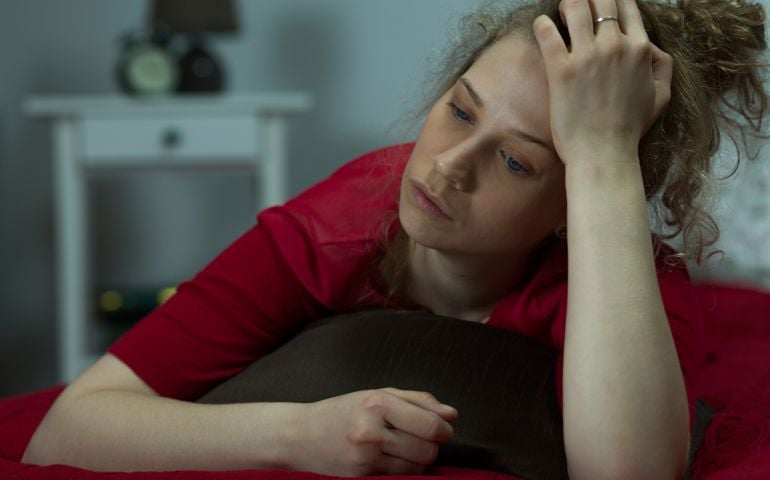 sad and disconnected woman staring into space