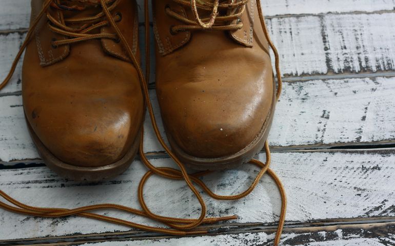 work boots, with white helmet and yellow meter