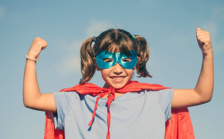 Little girl playing superhero