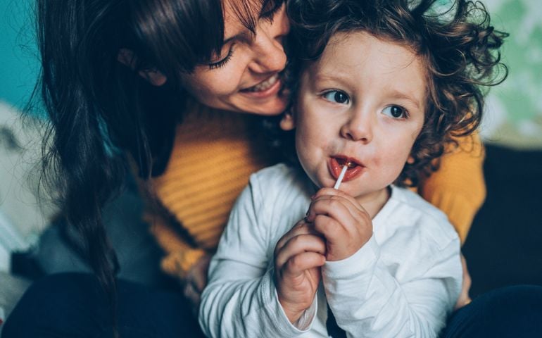 Portrait of happy mother with charming son