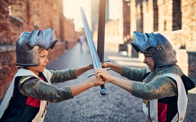 Serious little knights fighting. Shot on bridge in Verona. Nikon D850