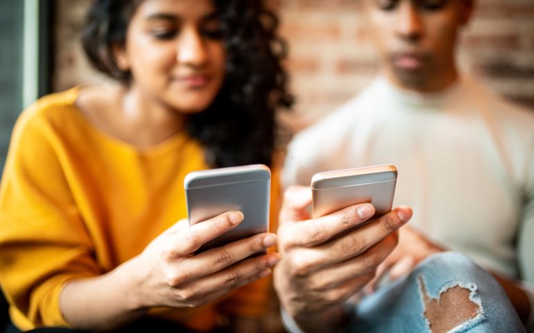 Friends sending money through digital wallet