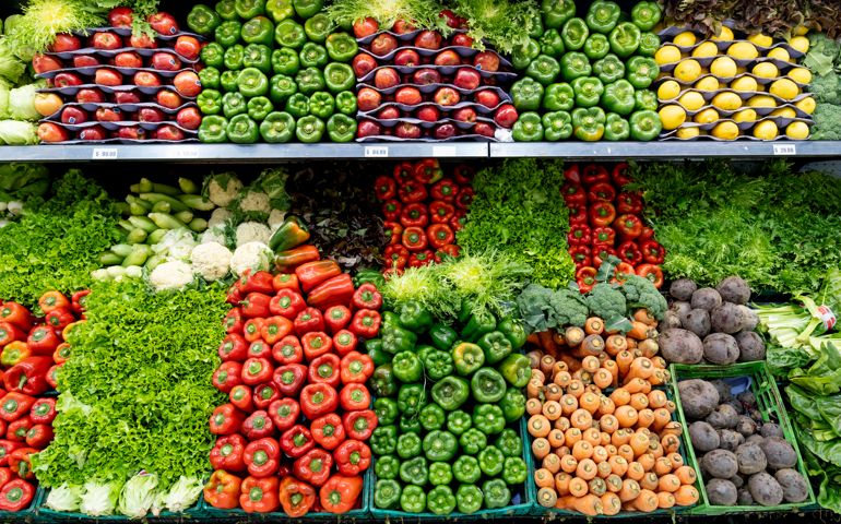 Delicious fresh vegetables and fruits at the refrigerated section of a supermarket - Healthy food