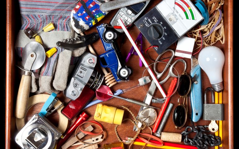 Drawer with many miscellaneous objects.