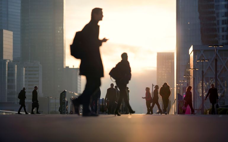 Morning image with business people and office workers arriving by subway at La Defense business district in Paris, France.