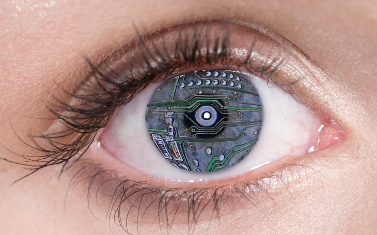 Close Up of blue eye with computer circuit board lines, digital composite