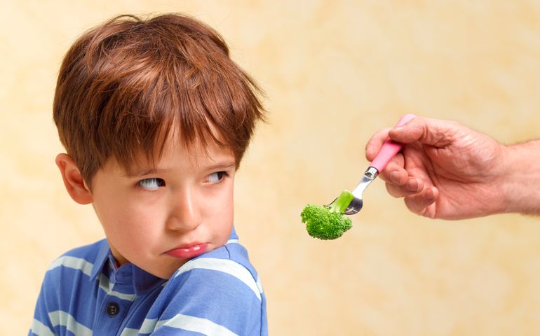 BOY REFUSING TO EAT HIS VEGETABLES