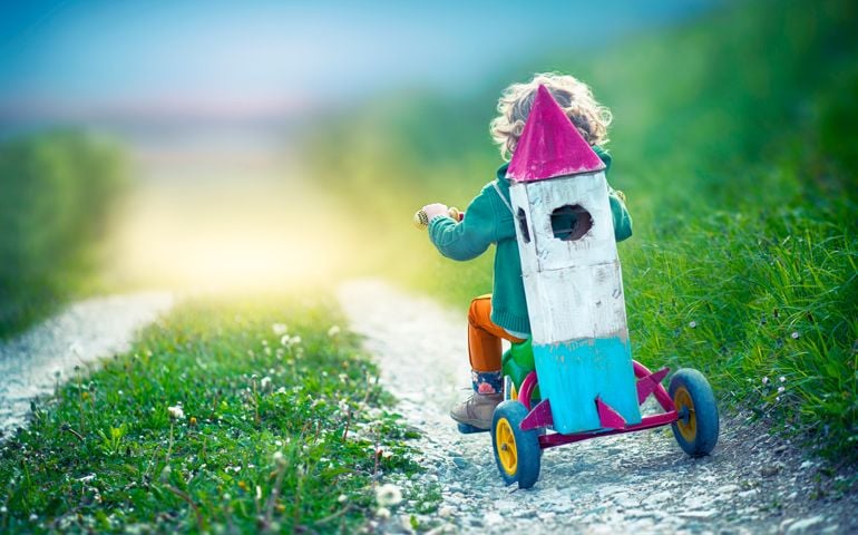 Child Carrying a Toy Space Rocket