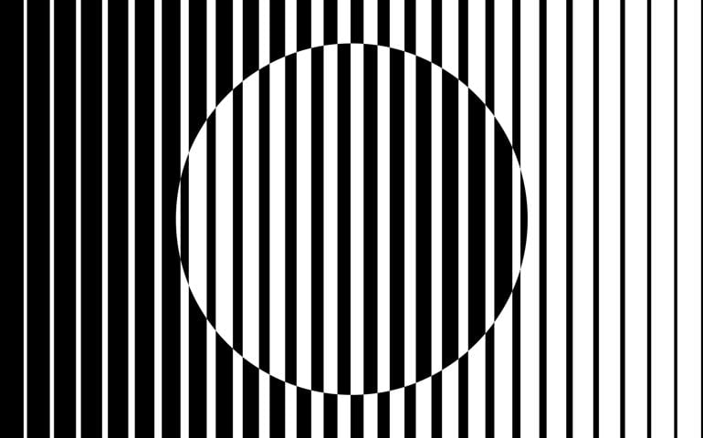 Abstract op art background made from black and white lines causing a circle shape illusion.