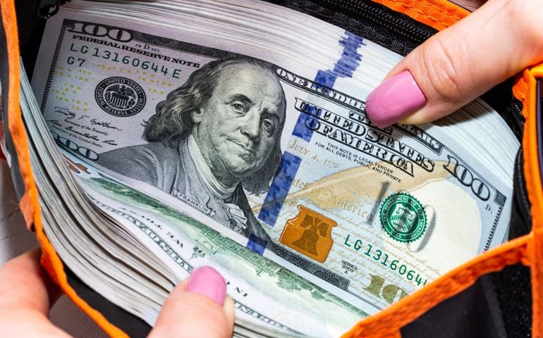 Full wallet with money.