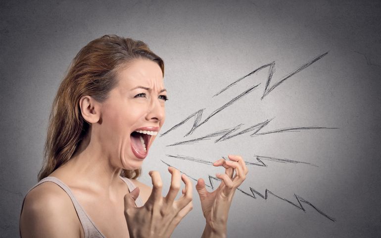 Side view portrait angry woman screaming