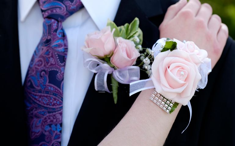 Hands of date Prom night flowers corsage formal wear