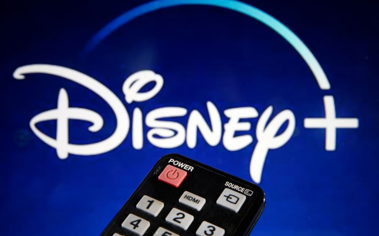 PARIS, FRANCE - MARCH 28: In this photo illustration, a remote control is seen in front of a television screen showing a Disney + logo on March 28, 2020 in Paris, France. At the request of the French government, the Disney + streaming platform has decided to postpone its launch in France to April 7.