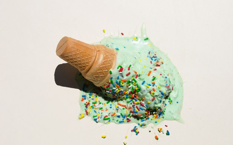 Ice cream cone smashed on white background