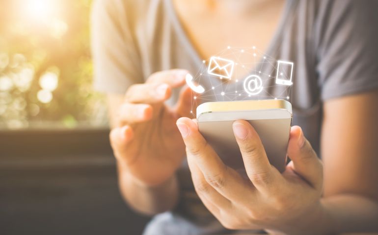 Woman hand using smart phone