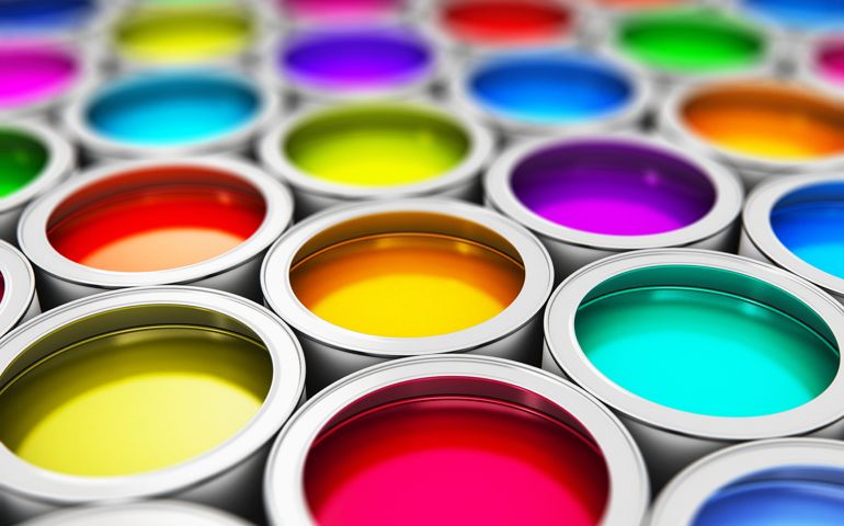 Abstract creativity concept: group of tin metal cans with color paint dye
