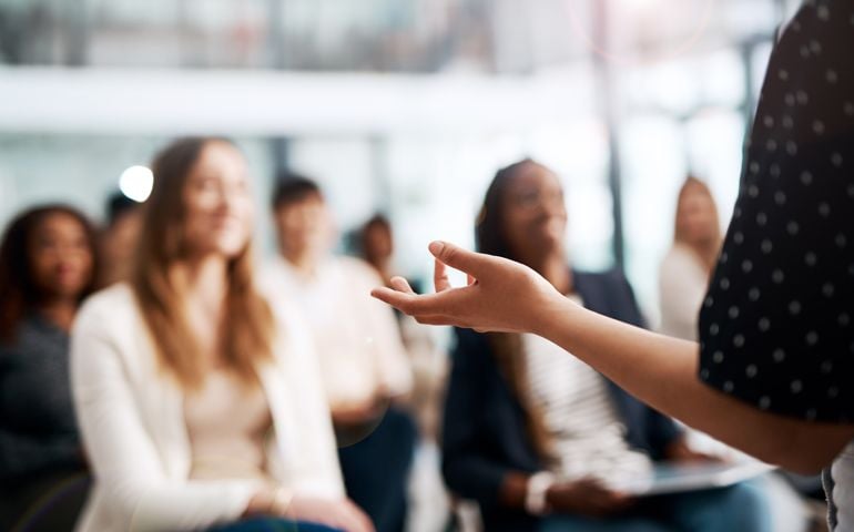 Cropped shot of a businesswoman delivering a speech during a conference