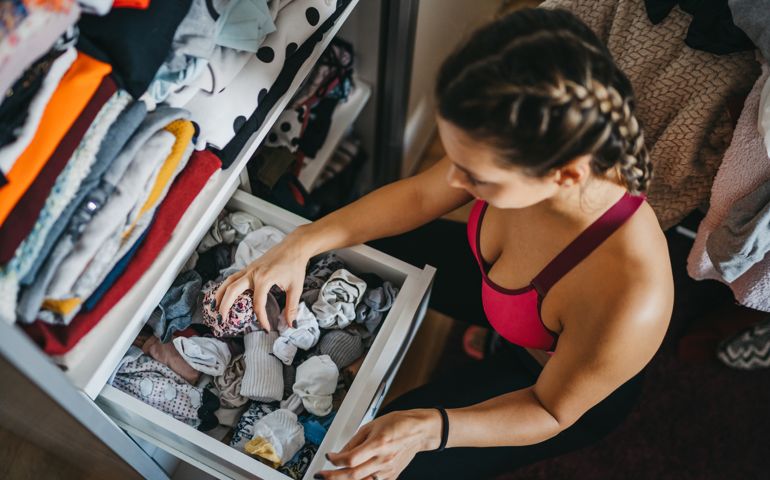 Woman sorting out wardrobe