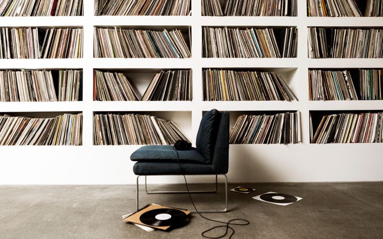 A collection of vinyl records on shelfs.