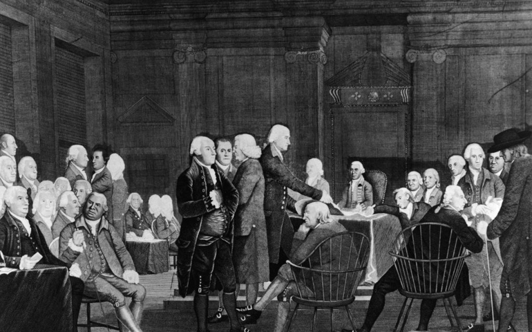 Members of the Second Continental Congress prepare documentation for the Declaration of Independence in the Assembly Room of the Pennsylvania State House, Philadelphia, Pennsylvania, July 2, 1776.