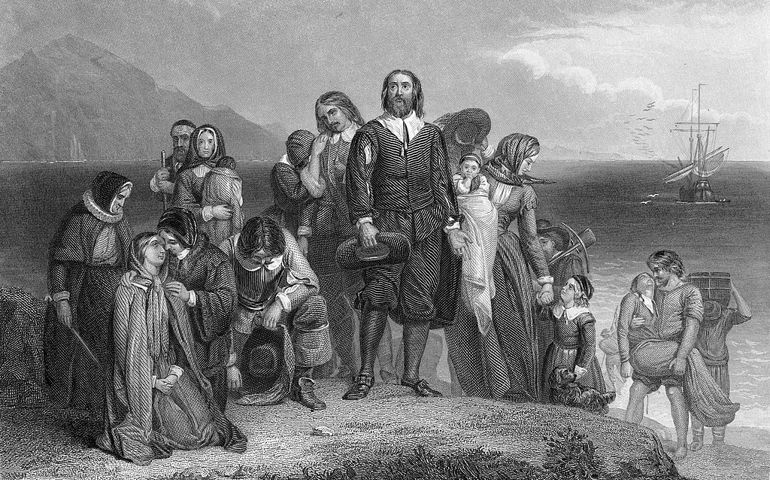 An engraving depicts the arrival of the pilgrims at Plymouth Rock, on the coast of what became Massachussetts, 1620.