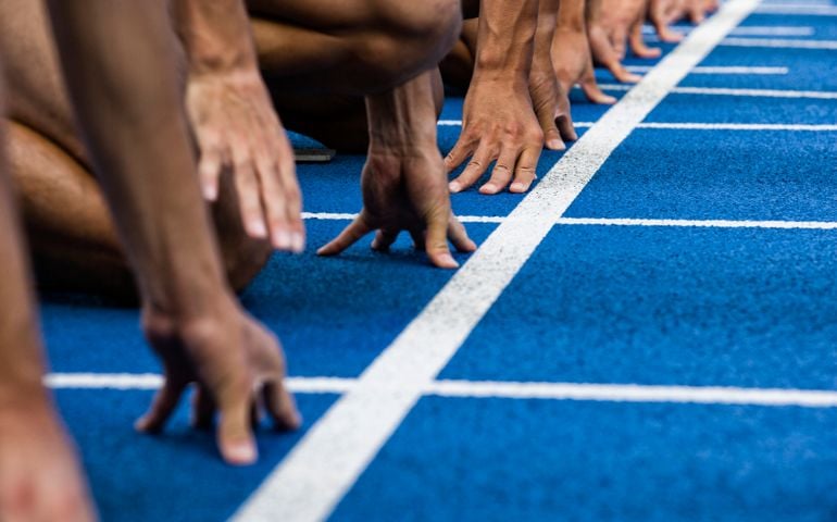 Track sprinters lined up at starting