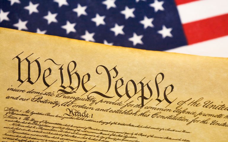 Constitution with USA flag background