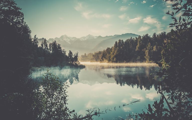 Lake Matheson Nature Panorama at Sunrise, New Zealand