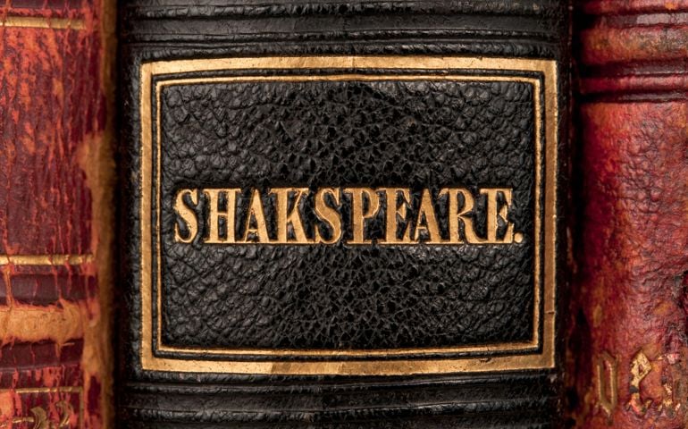 Antique (1839) leather-bound volume of Shakespeare's Dramatic Works. Detail of book spine focusing on the name "Shakspeare" (old spelling).