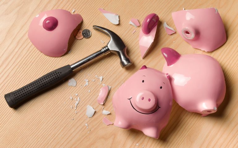 Smashed piggy bank with change