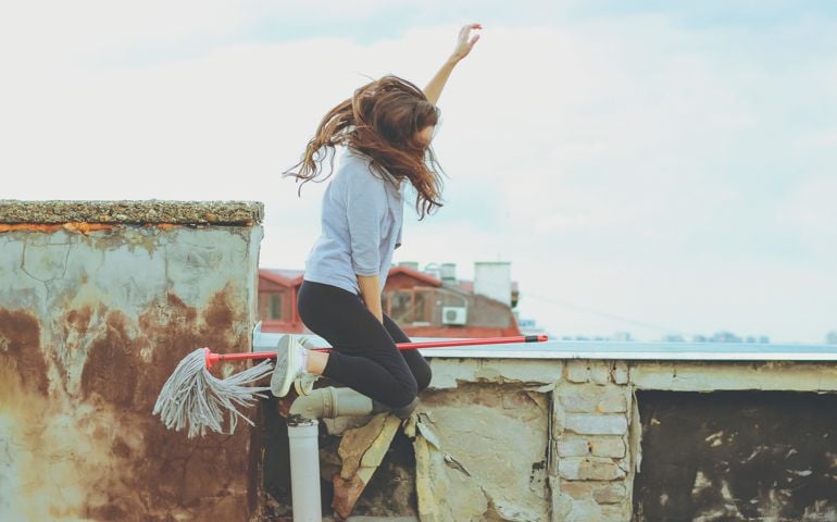 Woman flying on a broom