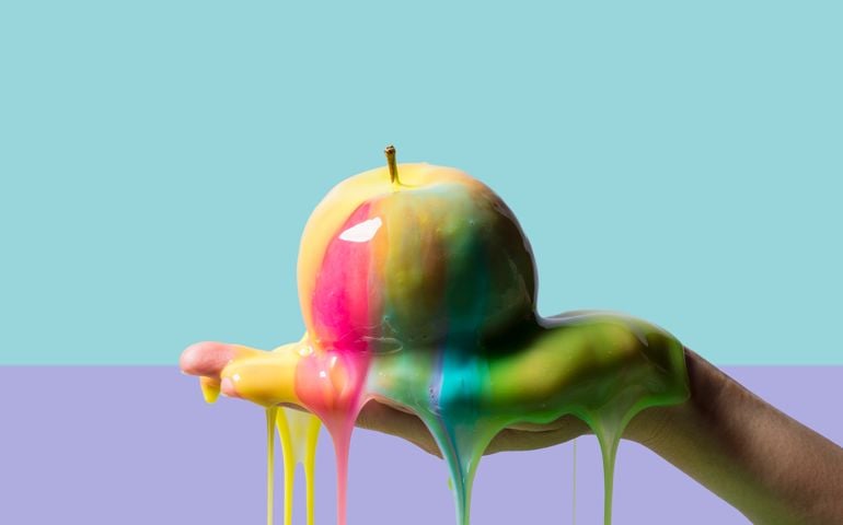 Apple and slime on color blocked background