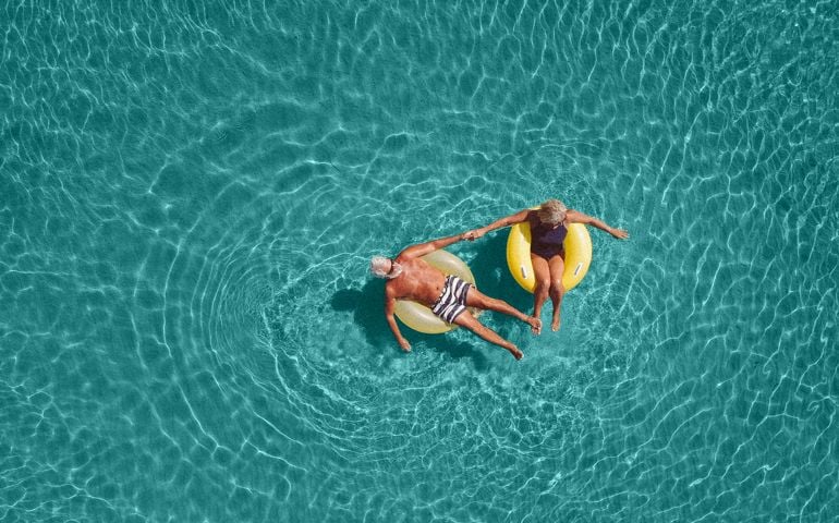 Senior couple enjoy sea water