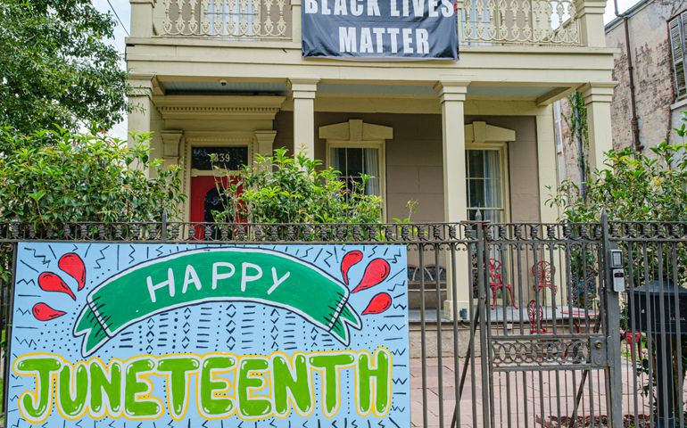 Black Lives Matter and Happy Juneteenth signs in front of house on Esplanade Avenue in Treme neighborhood