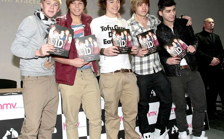 Niall Horan, Louis Tomlinson, Harry Styles and Liam Payne and Zayn Malik of One Direction attends meet and greet with fans to sign copies of their book. Forever Young at HMV Market Street on March 7, 2011 in Manchester, England.