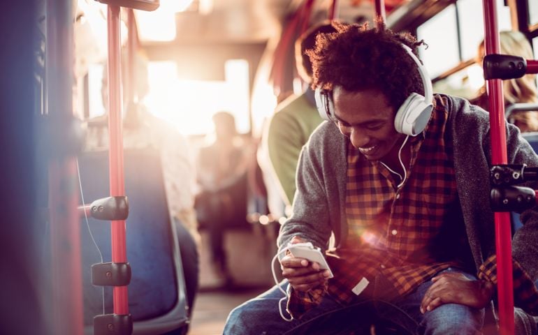 Close up of a student listening to music