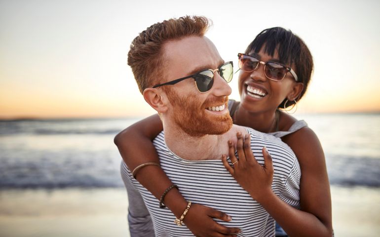 Shot of a happy young couple spending the day at the beach