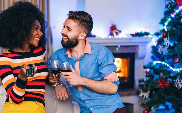 Couple celebrating new year and watching tv