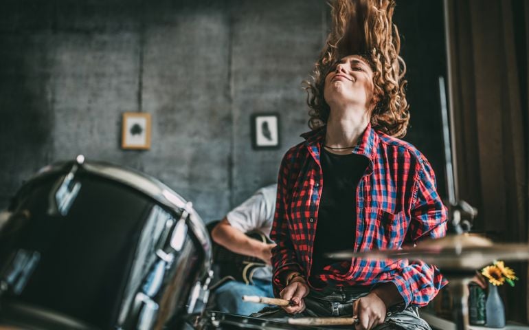 Teenager Playing Rock and Roll At Home