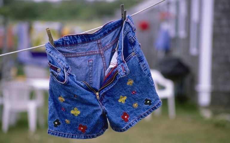 blue shorts with flowers on clothes line