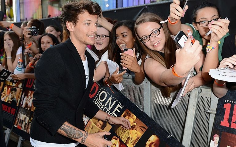 Singer Louis Tomlinson from One Direction attends the "One Direction This Is Us" world premiere at the Empire Leicester Square on August 20, 2013 in London, England.