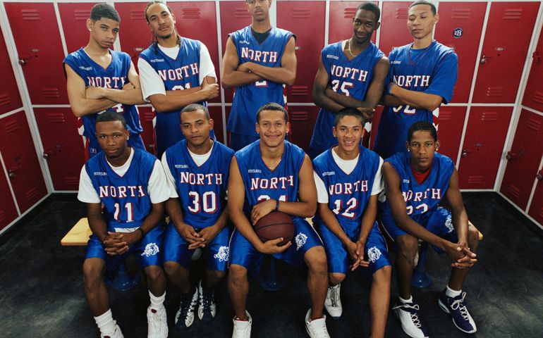 Teenage basketball players (16-18) in locker room, portrait