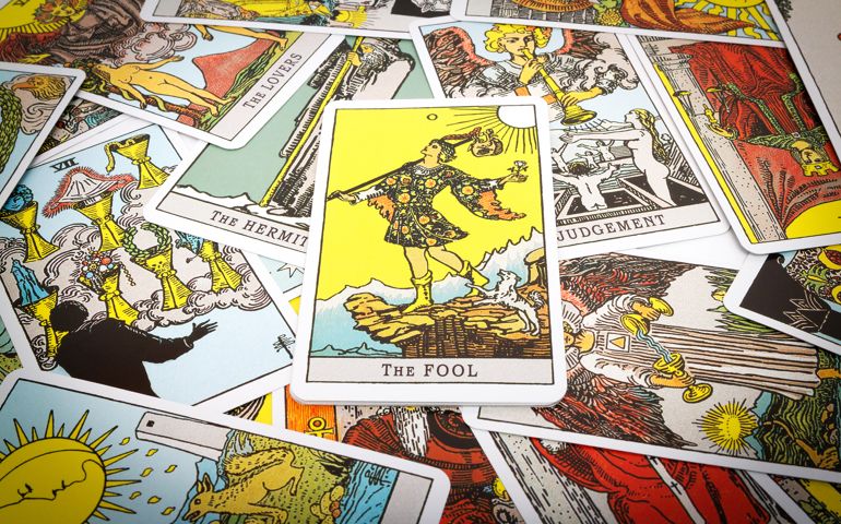 Tarot cards Tarot, the fool card in the foreground.