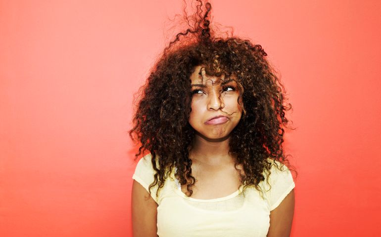Young Woman Having Bad Hair Day
